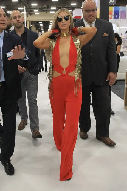 Paris Hilton promotes her new makeup line at Cosmoprof in Las Vegas, Nevada on July 30, 2018. The reality star was eye catching in a red jumpsuit. (Photo by Splash News and Pictures)
