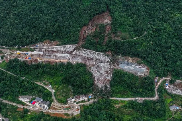 This aerial photo taken on July 9, 2023 shows the landslide site in Yueshan Village under Tujia Autonomous County of Wufeng, central China's Hubei Province. Five people have been rescued while nine others are still missing after a landslide hit a highway construction site in central China's Hubei Province on Saturday, local authorities said Sunday. (Photo by Wu Zhizun/Xinhua News Agency)