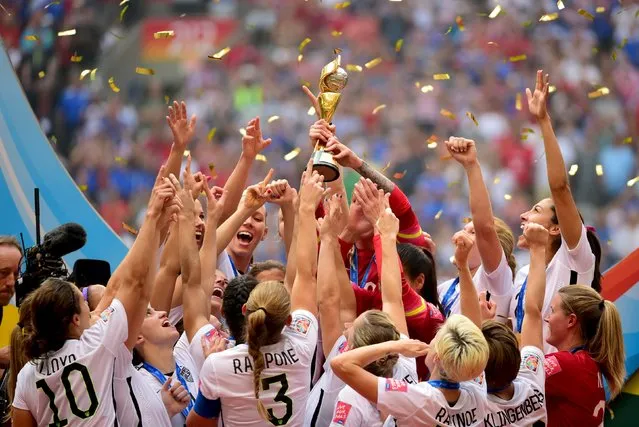 Jul 5, 2015; Vancouver, British Columbia, CAN; United States players react as they receive the FIFA Women's World Cup trophy after defeating Japan in the final of the FIFA 2015 Women's World Cup at BC Place Stadium. (Photo by Anne-Marie Sorvin/USA TODAY Sports)
