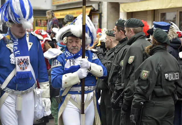 Police secure the traditional carnival parade in Cologne, western Germany, Monday, February 16, 2015. (Photo by Martin Meissner/AP Photo)