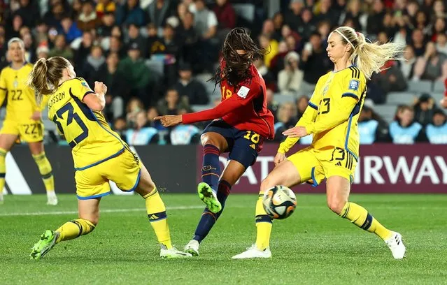 Salma Paralluelo of Spain shoots past Elin Rubensson and Amanda Ilestedt of Sweden to score her team's first goal during the FIFA Women's World Cup Australia & New Zealand 2023 Semi Final match between Spain and Sweden at Eden Park on August 15, 2023 in Auckland, New Zealand. (Photo by Molly Darlington/Reuters)