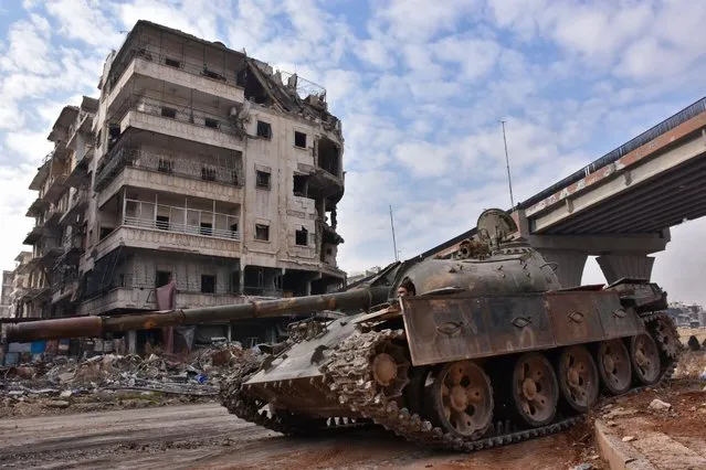 Syrian government troops patrol the newly captured al- Sakhour neighbourhood in the eastern part of the northern city of Aleppo on December 7, 2016 Rebels in Aleppo called for a five- day truce and the evacuation of civilians Wednesday after losing more than three quarters of their territory including the Old City to a Syrian army offensive. (Photo by George Ourfalian/AFP Photo)