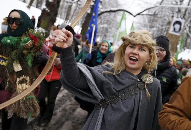 Environmental activists march in defence of Europe's last ancient forest, the Bialowieza Primeval Forest, in Warsaw, Poland January 17, 2016. Activists are against plans to increase the felling of trees by local forest authorities, who say the move is needed to contain an European bark beetle outbreak from affecting more trees in the ancient forest, according to local media. (Photo by Kacper Pempel/Reuters)
