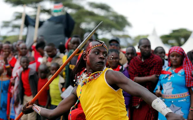 Njama Tipis, a Maasai moran from Rombo Manyatta, competes in the 2016 Maasai Olympics at the Sidai Oleng Wildlife Sanctuary, at the base of Mt. Kilimanjaro, near the Kenya-Tanzania border in Kimana, Kajiado, Kenya December 10, 2016. (Photo by Thomas Mukoya/Reuters)