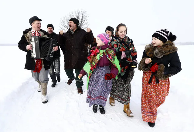 Villagers take part in Kolyada holiday celebrations in the village of Martsiyanauka, Belarus, January 21, 2016. (Photo by Vasily Fedosenko/Reuters)