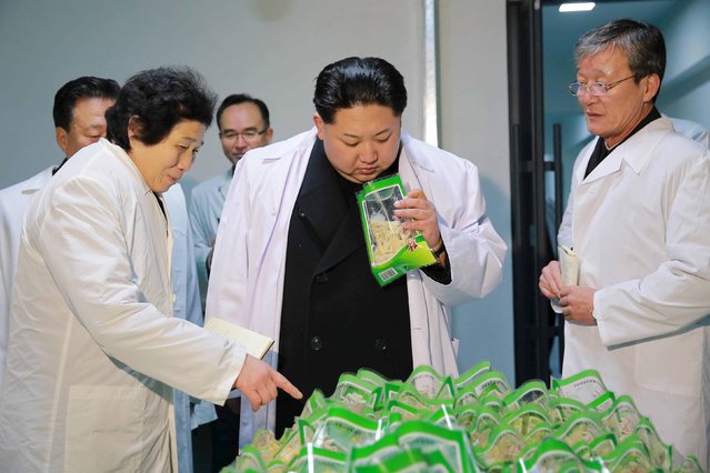 North Korean leader Kim Jong Un (C) visits the Kumkop General Foodstuff Factory for Sportspersons in this undated photo released by North Korea's Korean Central News Agency (KCNA) in Pyongyang January 23, 2016. (Photo by Reuters/KCNA)