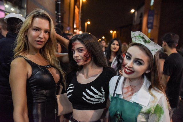 Students wore their best Halloween costumes for the annual fright-fest in Birmingham, United Kingdom on October 31, 2018. Boozy students hit bars and clubs last night wearing their spookiest attire. (Photo by Caters News Agency)