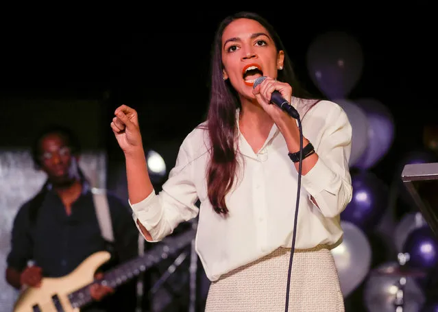 New York Democratic Congressional candidate Alexandria Ocasio-Cortez speaks to supporters, Tuesday, November 6, 2018 in Queens the Queens borough of New York, after defeating Republican challenger Anthony Pappas in the race for the 14th Congressional district of New York. (Photo by Stephen Groves/AP Photo)