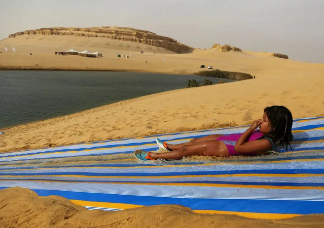 EGYPT: A girl slides down a ramp into the lake in Wadi el-Rayan Fayoum, Egypt, November 18, 2016. (Photo by Mohamed Abd El Ghany/Reuters)