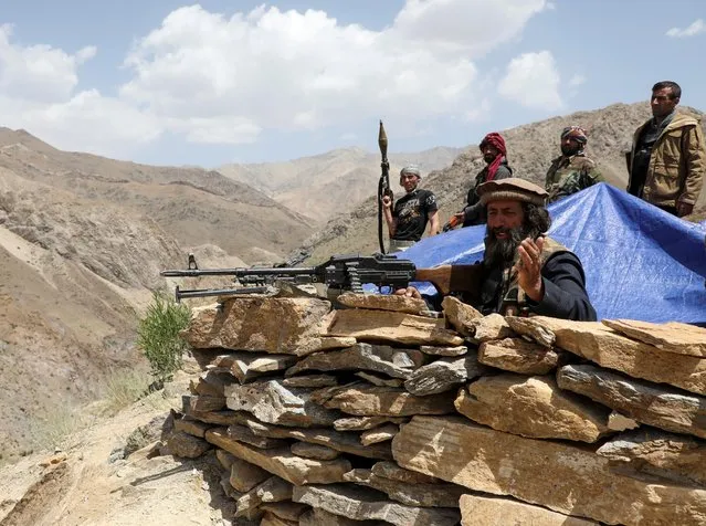 Armed men who are against Taliban uprising stand at their check post, at the Ghorband District, Parwan Province, Afghanistan on June 29, 2021. (Photo by Omar Sobhani/Reuters)