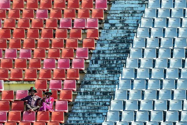 Bangladeshi cricket fans enjoy the second day of the first Test cricket match between Bangladesh and West Indies at the Zahur Ahmed Chowdhury Stadium in Chittagong on November 23, 2018. (Photo by Munir Uz Zaman/AFP Photo)