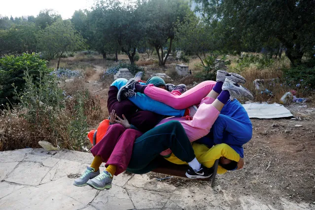 Dancers participate in a “Bodies in Urban Spaces” event choreographed by Austrian artist Willi Dorner as part of the Israel Festival, in Jerusalem May 31, 2018. (Photo by Ronen Zvulun/Reuters)