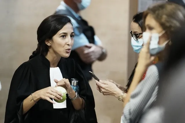 Salah Abdeslam's lawyer Olivia Ronen, left, talks outside the courtroom Wednesday, September 8, 2021 in Paris. The trial of 20 men accused in the Islamic State group's coordinated attacks on Paris in 2015 that transformed France opened Wednesday in a custom-built complex embedded within a 13th-century courthouse. Nine gunmen and suicide bombers struck within minutes of each other at several locations around Paris on Nov. 13, 2015, leaving 130 people dead and spreading fear across the nation. (Photo by Thibault Camus/AP Photo)