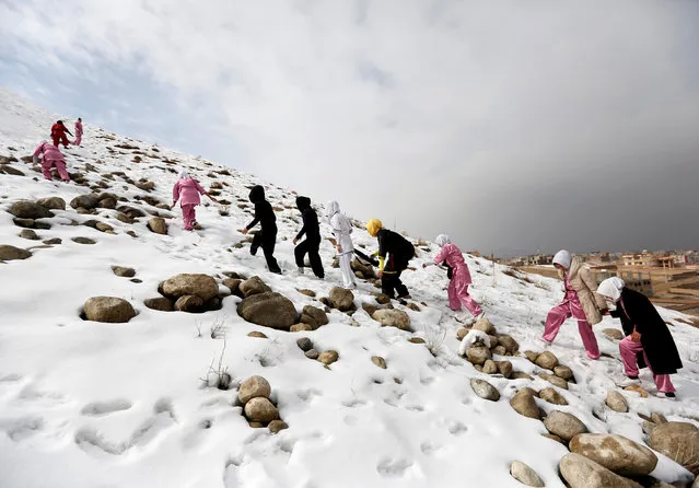 Students of the Shaolin Wushu club climb a hill as they arrive to practice in Kabul, Afghanistan January 29, 2017. (Photo by Mohammad Ismail/Reuters)