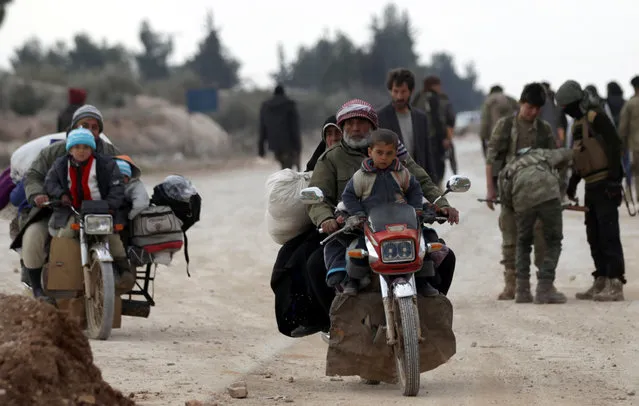 People who fled the violence from the Islamic State-controlled northern Syrian town of al-Bab arrive on the outskirts of the Free Syrian Army and Turkish forces controlled al Baza'a village in Syria  February 4, 2017. (Photo by Khalil Ashawi/Reuters)