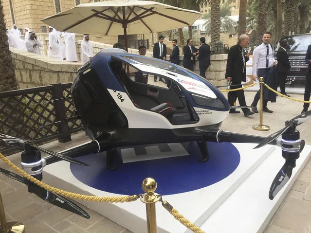 A model of EHang 184 and the next generation of Dubai Drone Taxi is seen during the second day of the World Government Summit in Dubai, United Arab Emirates, Monday, February 13, 2017. Dubai hopes to have a passenger-carrying drone buzzing through the skyline of this futuristic city-state in July. Mattar al-Tayer, the head of Dubai's Roads & Transportation Agency, made the surprise announcement Monday at the World Government Summit. (Photo by Jon Gambrell/AP Photo)