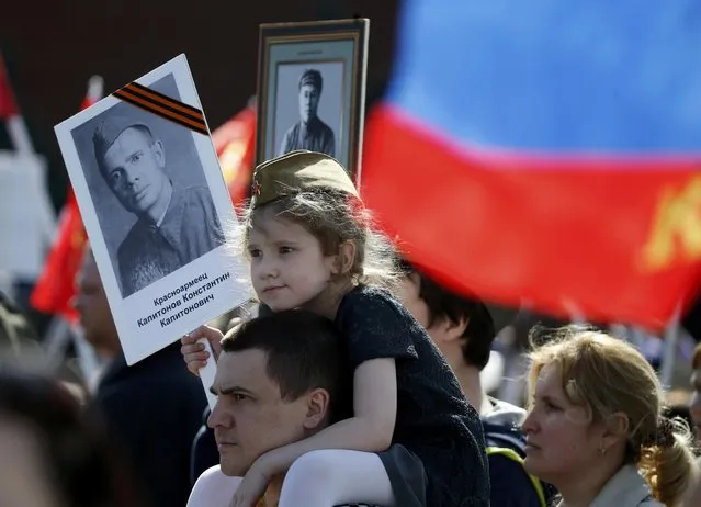 Participants of the Immortal Regiment march carry portraits of their relatives who took part in World War Two in central Moscow, Russia, May 9, 2015. (Photo by Sergei Karpukhin/Reuters)