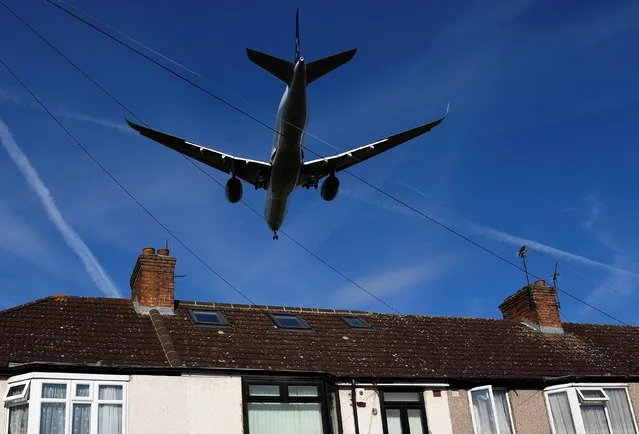 A passenger plane comes into land at London Heathrow airport, which posts its first-half results following the outbreak of the coronavirus, in London, Britain, July 29, 2020. (Photo by Toby Melville/Reuters)