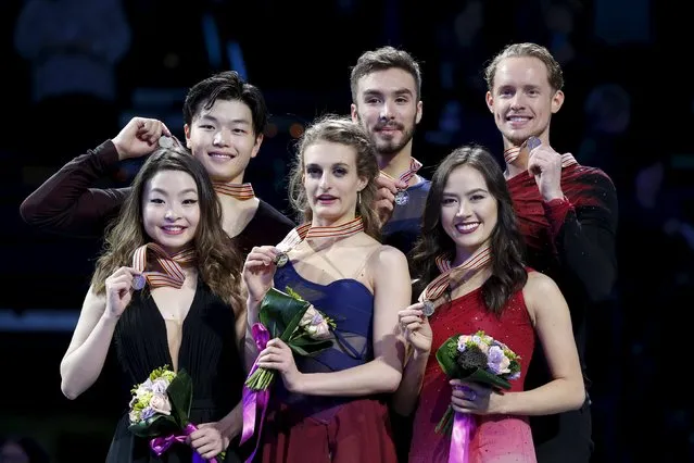 Figure Skating, ISU World Figure Skating Championships, Ice Dance Free Dance, Boston, Massachusetts, United States on March 31, 2016: Silver medalists Maia Shibutani (L) and Alex Shibutani (2nd L) of the United States, gold medalists Gabriella Papadakis (3rd L) and Guillaume Cizeron (3rd R) of France, and bronze medalists Madison Chock (2nd L) and Evan Bates (R) of the United States pose on the medals podium. (Photo by Brian Snyder/Reuters)