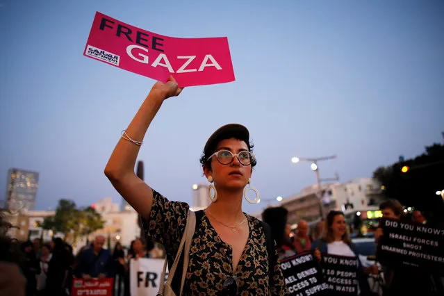 A protester holds a placard as she takes part in a demonstration calling for an end to Israel's policy towards Gaza and a boycott of the 2019 Eurovision Song Contest as the first semi final of the contest begins in Tel Aviv, Israel May 14, 2019. (Photo by Corinna Kern/Reuters)