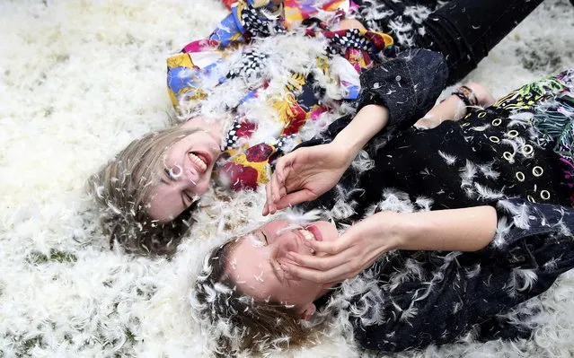 Participants take part in International Pillow Fight Day in Kennington Park in south London, Britain April 2, 2016. (Photo by Neil Hall/Reuters)