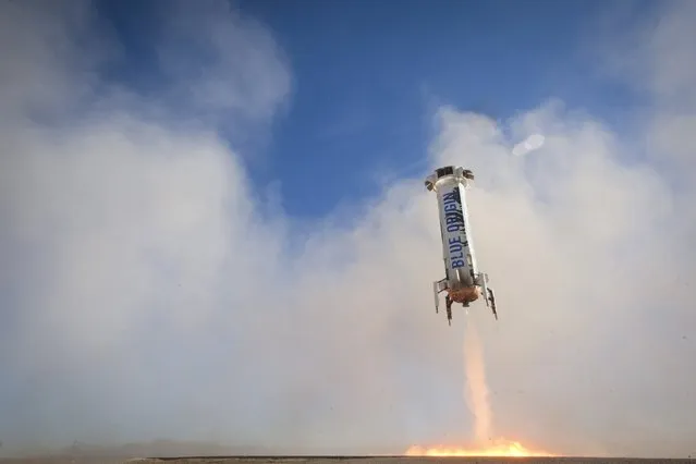 The New Shepard rocket booster lands in this handout photo provided by Blue Origin, in West Texas April 2, 2016. Jeff Bezos' space transportation company Blue Origin successfully launched and landed for the third time a suborbital rocket capable of whisking six passengers off their home planet, taking another step on the company's quest to develop reusable boosters, the company said on Saturday. (Photo by Reuters/Blue Origin)