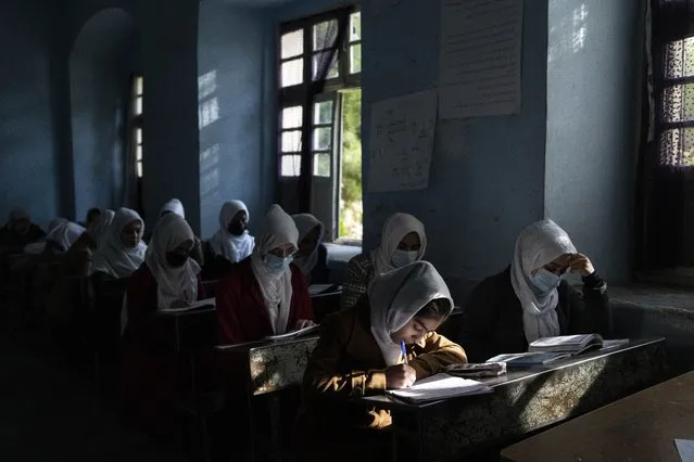 Afghan girls participate a lesson at Tajrobawai Girls High School, in Herat, Afghanistan, Thursday, November 25, 2021. (Photo by Petros Giannakouris/AP Photo)
