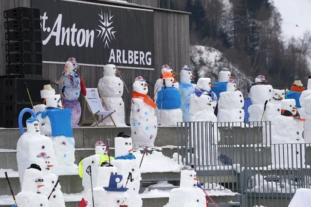 Snowmen fill the tribune at the finish line during training for an alpine ski, women's World Cup downhill in St. Anton, Austria, Friday, January 8, 2021. (Photo by Giovanni Auletta/AP Photo)
