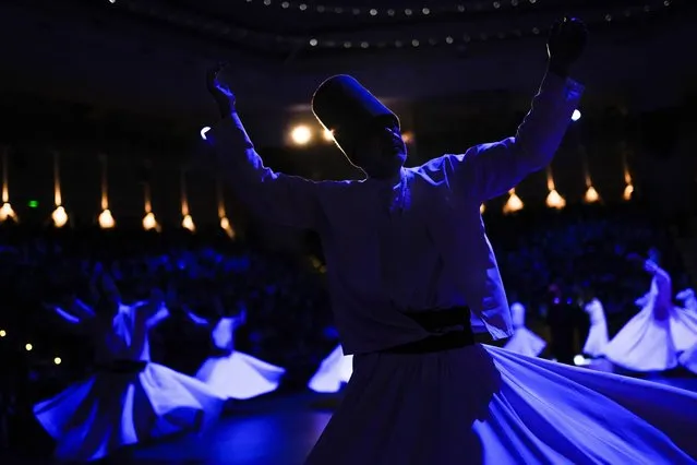 Whirling dervishes perform during a Sheb-i Arus ceremony in Konya, central Turkey on Friday, December 17, 2021. Every December the Anatolian city hosts a series of events to commemorate the death of 13th century Islamic scholar, poet and Sufi mystic Jalaladdin Rumi. (Photo by Francisco Seco/AP Photo)