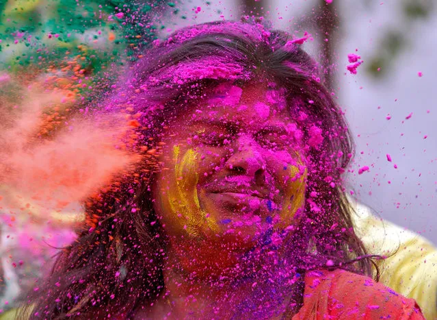 A college student reacts as coloured powder is thrown into her face during Holi, the Festival of Colours, celebrations in Agartala, March 10, 2017. (Photo by Jayanta Dey/Reuters)