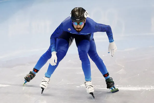 Kazakhstan's Denis Nikisha competes in the final B of the mixed team relay short track speed skating event during the Beijing 2022 Winter Olympic Games at the Capital Indoor Stadium in Beijing on February 5, 2022. (Photo by Evgenia Novozhenina/Reuters)
