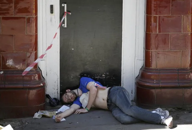 An actor lies on the ground during Exercise Strong Tower at the scene of a mock terror attack at a disused underground station in central London, Britain June 30, 2015. (Photo by Peter Nicholls/Reuters)