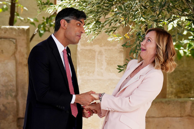 British Prime Minister Rishi Sunak is greeted by Italian Prime Minister Giorgia Meloni during a welcome ceremony on day one of the 50th G7 summit at Borgo Egnazia on June 13, 2024 in Fasano, Italy. The G7 summit in Puglia, hosted by Italian Prime Minister Giorgia Meloni, the seventh held in Italy, gathers leaders from the seven member states, the EU Council, and the EU Commission. Discussions will focus on topics including Africa, climate change, development, the Middle East, Ukraine, migration, Indo-Pacific economic security, and artificial intelligence. (Photo by Christopher Furlong/Getty Images)