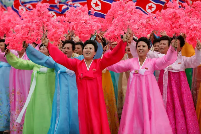 People react as they see North Korean leader Kim Jong Un during a mass rally and parade in the capital's main ceremonial square, a day after the ruling party wrapped up its first congress in 36 years by elevating him to party chairman, in Pyongyang, North Korea, May 10, 2016. (Photo by Damir Sagolj/Reuters)