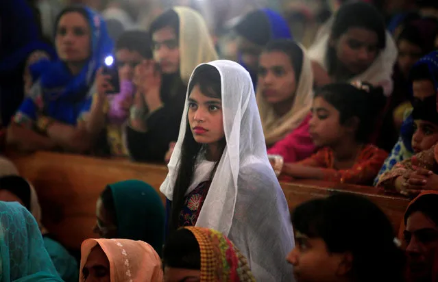 A girl attends the Easter mass at the Fatima Church in Islamabad, Pakistan, April 16, 2017. (Photo by Faisal Mahmood/Reuters)