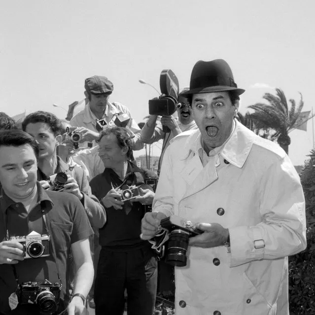 Comedian, director and singer Jerry Lewis jokes with photographers, May 4, 1967, at his arrival at the International Cannes Film Festival in Cannes, France. (Photo by STF/AFP Photo/Getty Images)
