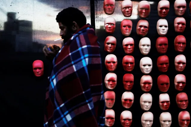 A homeless man walks past masks depicting faces of politicians during a protest by non-governmental organization (NGO) Rio de Paz (Rio of Peace) against political corruption scandals at Paulista Avenue in Sao Paulo, Brazil, June 1, 2017. (Photo by Nacho Doce/Reuters)