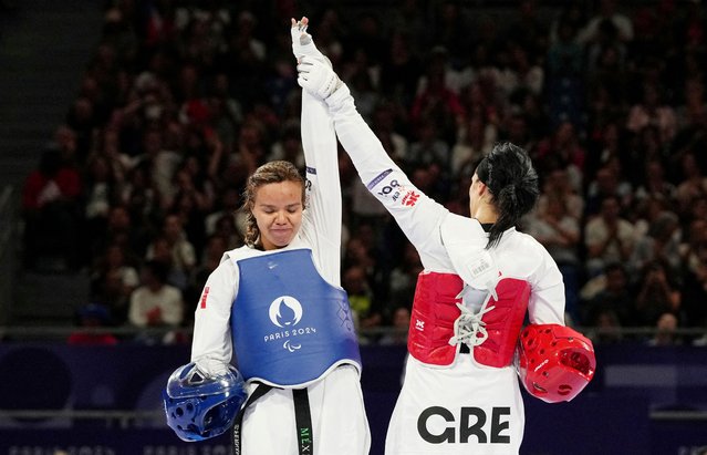 Eleni Papastamopoulou of Greece celebrates with Fernanda Vargas Fernandez of Mexico after the women's K44 65kg+ bronze medal contest in Paris, France on August 31, 2024. (Photo by Maja Smiejkowska/Reuters)