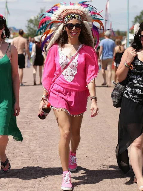 Ria Hebden walks at the Glastonbury Festival, at Worthy Farm in Somerset. (Photo by Yui Mok/PA Wire)