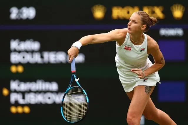Czech Republic's Karolina Pliskova serves the ball to Britain's Katie Boulter during their women's singles tennis match on the fourth day of the 2022 Wimbledon Championships at The All England Tennis Club in Wimbledon, southwest London, on June 30, 2022. (Photo by Adrian Dennis/AFP Photo)