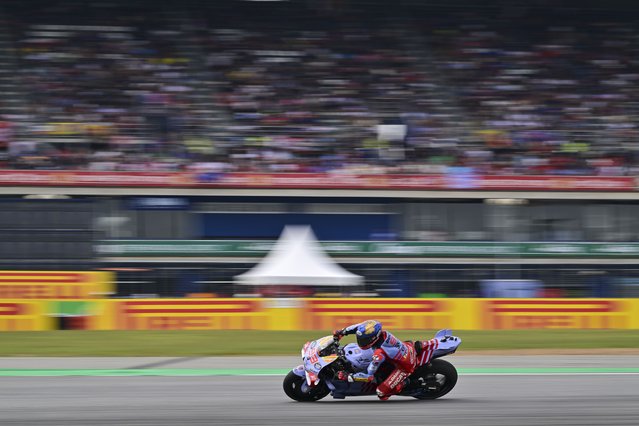 Spain's rider Marc Marquez steers his motorcycle during a practice round of Thailand's MotoGP at the Chang International Circuit in Buriram, Thailand, Saturday, October 26, 2024. (Photo by Kittinun Rodsupan/AP Photo)