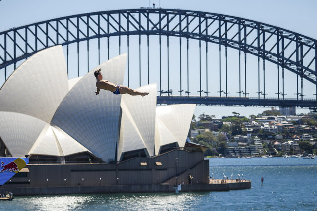 In this handout image provided by Red Bull, Aidan Heslop of the UK dives from the 27.5 metre platform during the first competition day of the eighth and final stop of the Red Bull Cliff Diving World Series on November 08, 2024 at Sydney, Australia. (Photo by Romina Amato/Red Bull via Getty Images)
