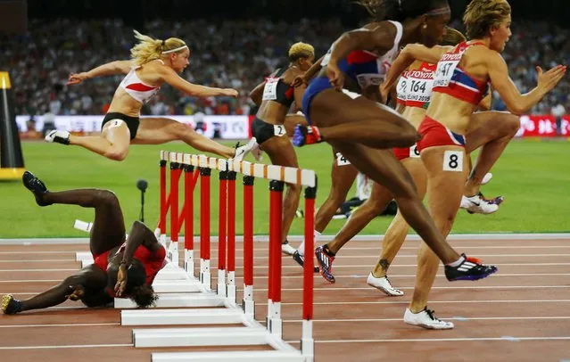 Dawn Harper Nelson of U.S. crashes into a hurdle in the women's 100 metres hurdles semi-final during the 15th IAAF World Championships at the National Stadium in Beijing, China August 28, 2015. (Photo by Damir Sagolj/Reuters)