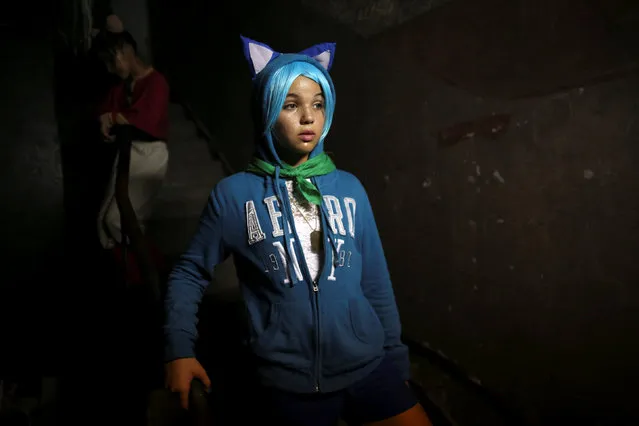 Melissa March, 13, is seen backstage during the Cuban Otaku festival in Havana, Cuba, July 24, 2016. (Photo by Alexandre Meneghini/Reuters)