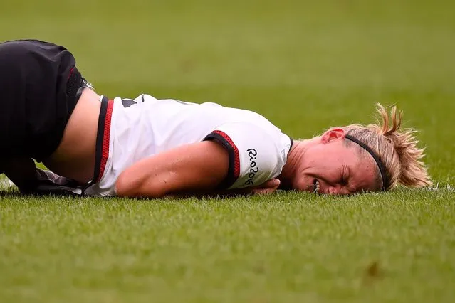 Alexandra Popp of Germany hits the ground after a tackle during the women's semifinal soccer match between Germany and Canada, August 16, 2016. (Photo by Pedro Vilela/Getty Images)