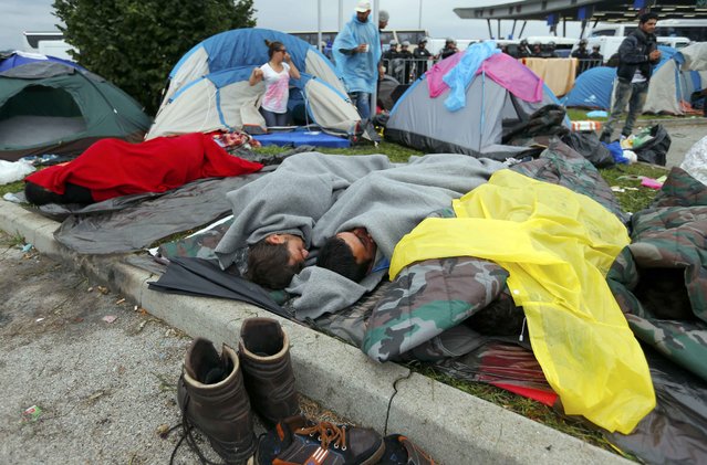 Migrants sleep beside tents at the Croatia-Slovenia border crossing at Bregana, Croatia, September 20, 2015. (Photo by Laszlo Balogh/Reuters)