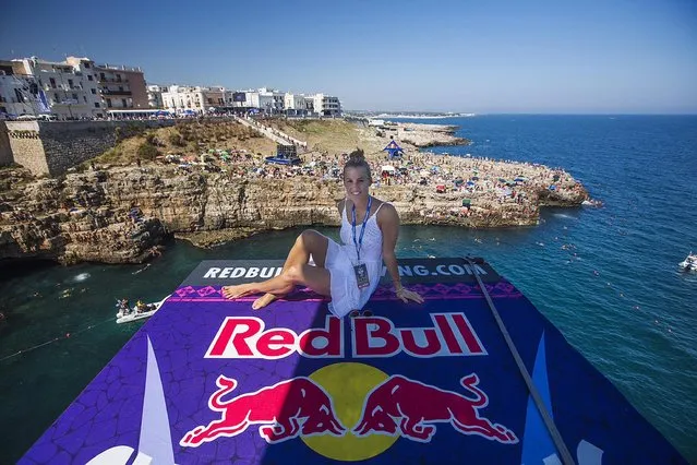Tania Cagnotto sits on the 27 metre platform during the first round of the fifth stop of the Red Bull Cliff Diving World Series in Polignano a Mare, Italy on August 27 2016. (Photo by Dean Treml/ANSA/Red Bull Press Office)