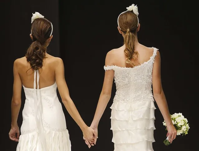 Models on the catwalk during a wedding fashion show with same-s*x couples, dubbed “The rainbow wedding fashion show”, part of a “wedding fair” taking place in Rome, Thursday, October 23, 2014. Silvio Berlusconi is pushing for the legalization of civil unions between gays in Italy, but not same-s*x marriage. (Photo by Domenico Stinellis/AP Photo)