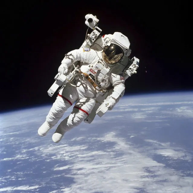 This February 7, 1984 photo made available by NASA shows astronaut Bruce McCandless II, participating in a spacewalk a few meters away from the cabin of the Earth-orbiting space shuttle Challenger, using a nitrogen-propelled Manned Maneuvering Unit. The Johnson Space Center says McCandless died Thursday, December 21, 2017 in California. (Photo by NASA via AP Photo)