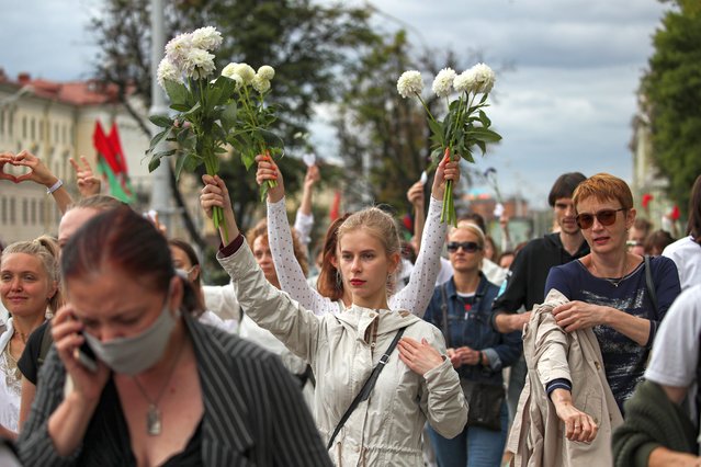 People rally in support of detained and injured participants of the protests that erupted in the aftermath of the presidential election, in Minsk, Belarus, 12 August 2020. Long-time President of Belarus Alexander Lukashenko won the elections by a landslide with 80 percent of the votes. The opposition does not recognise the results and has questioned the transparency of the counting process. (Photo by Tatiana Zenkovich/EPA/EFE)